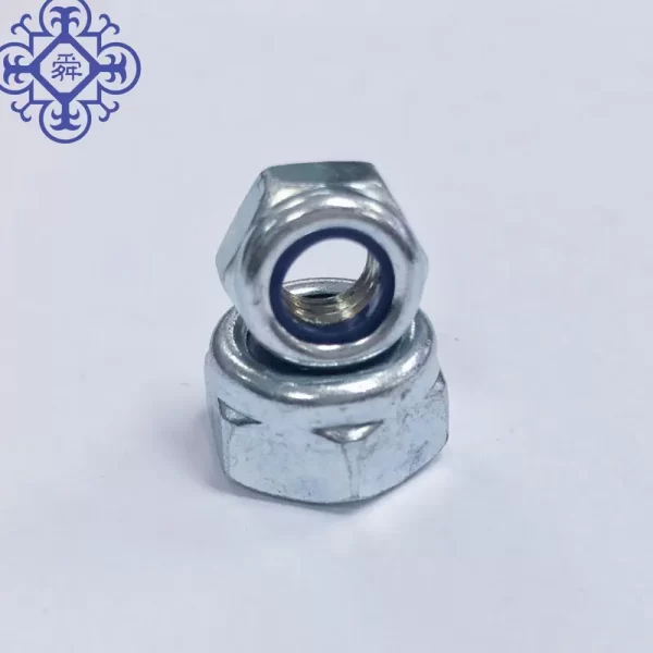 A 5.8mm White Zinc Plated Nylon Lock Nut DIN982 on top of a Hex Bolt.